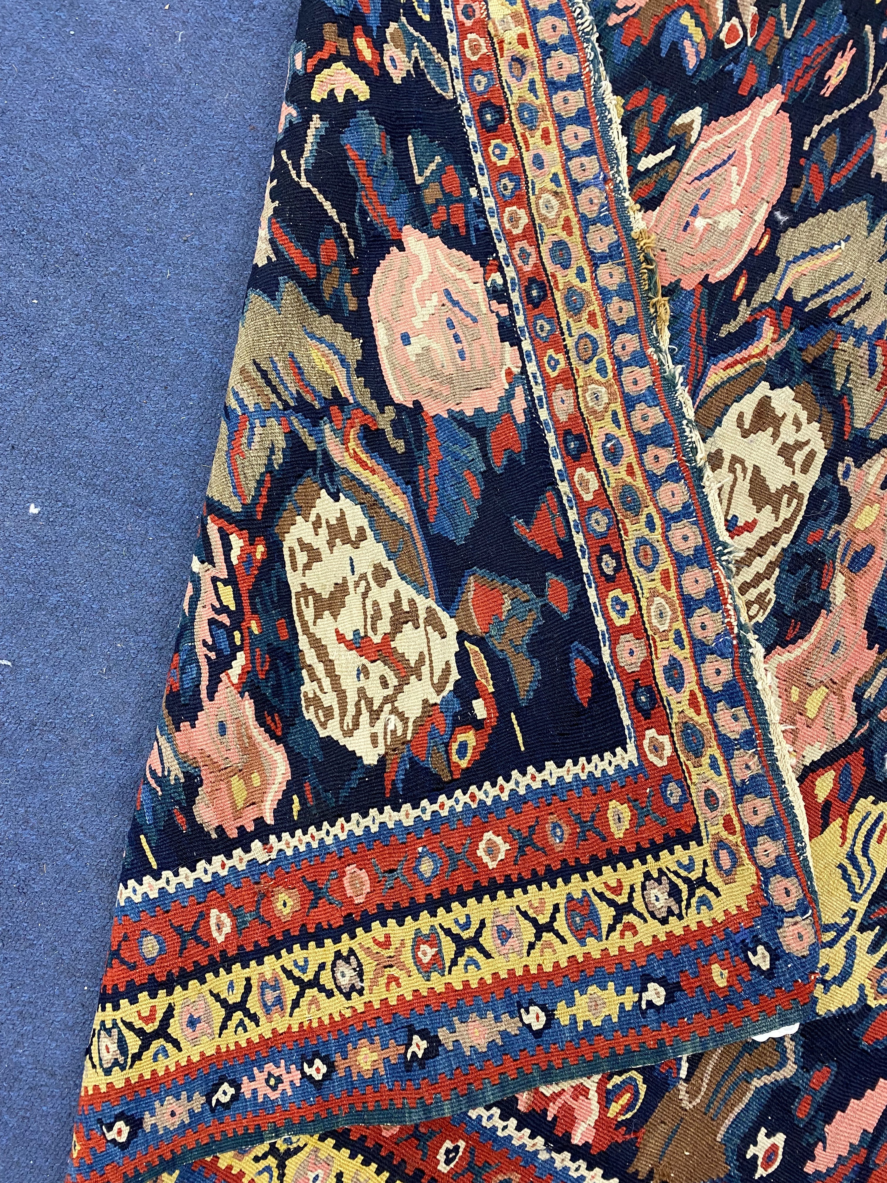 A late 19th century / early 20th century Senneh polychrome Kilim rug, 190 x 130cm